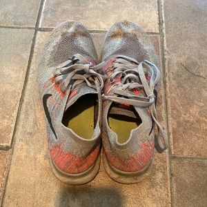 Pink and gray Nike running shoes